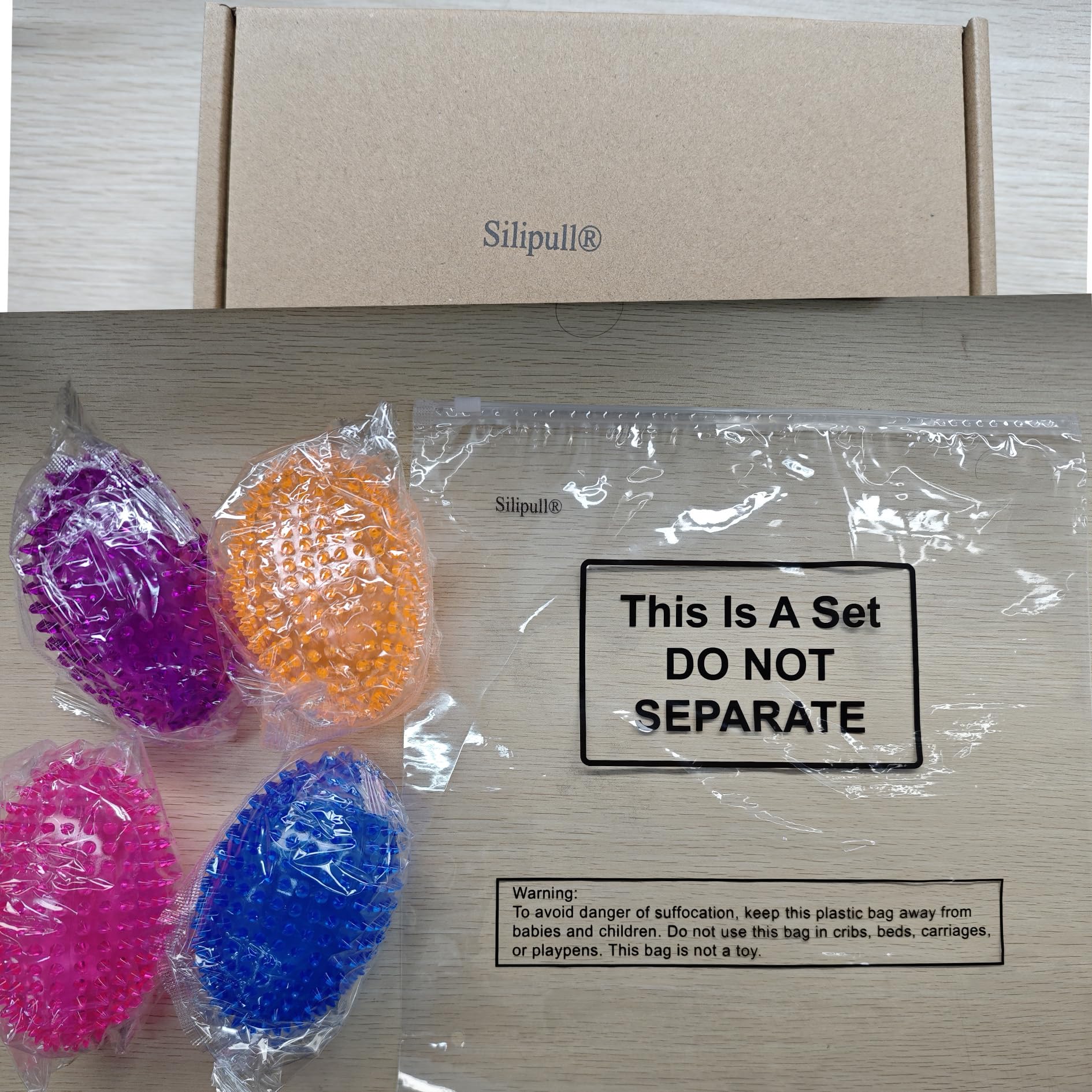 Silipull dog play scene shows medium to large dogs enjoying fetch
