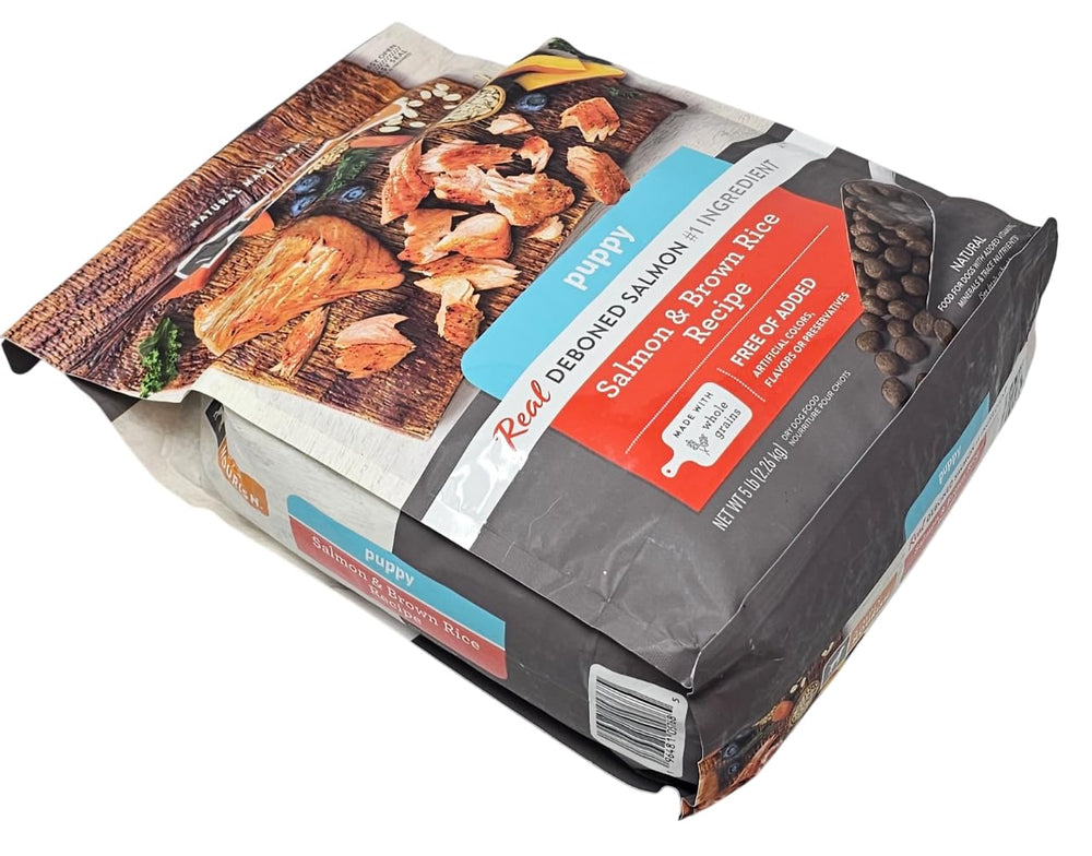 SIMPLY NOURISH puppy salmon kibble closeup highlighting real deboned salmon as first ingredient.