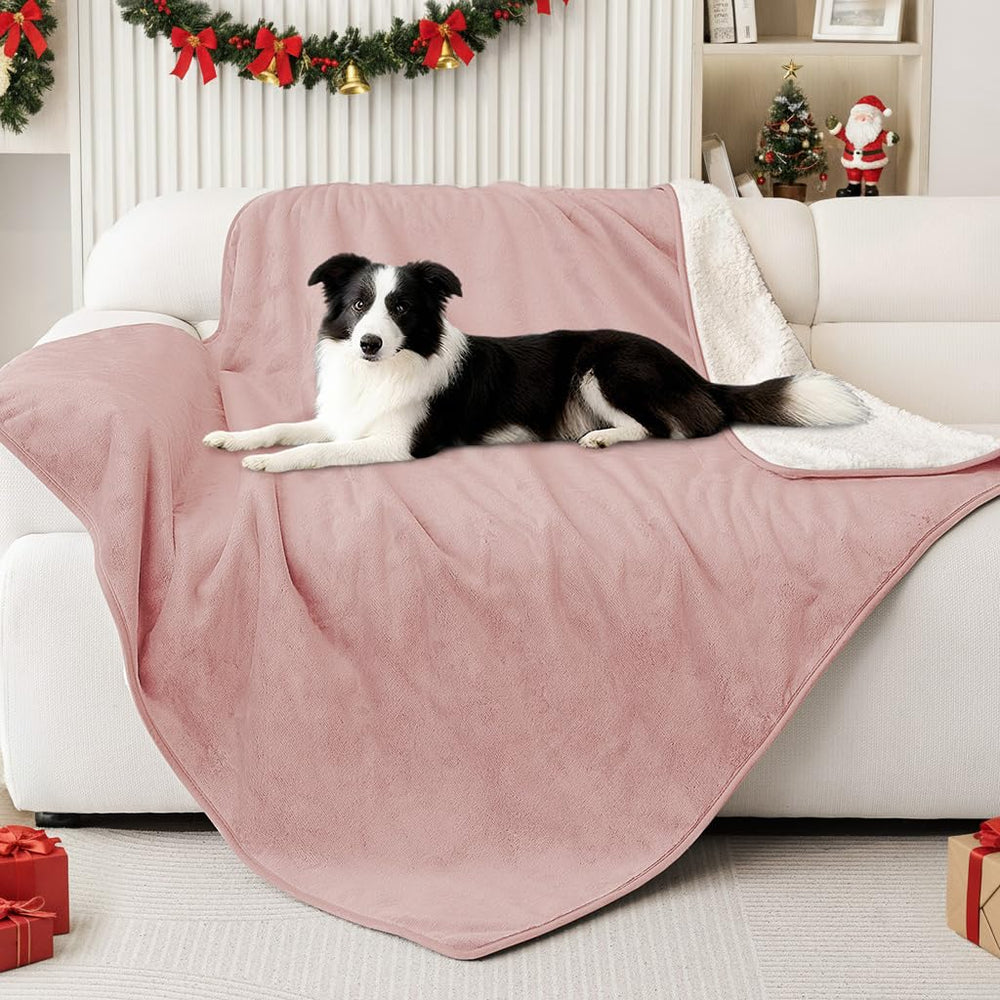 Smiry waterproof dog bed blanket with water-resistant lining protects spills on cozy dusty-pink surface.