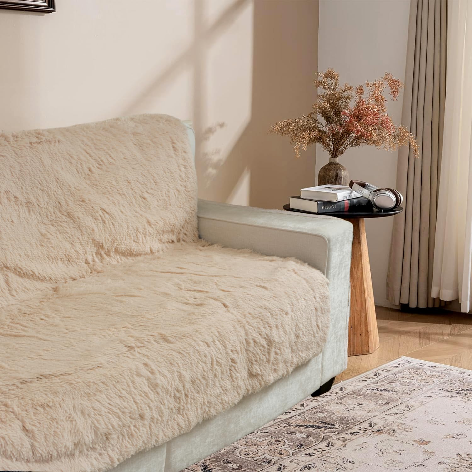 Snugglesinto beige dog pad on sofa delivers cozy pet comfort and furniture protection.