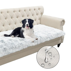 Snugglesinto dogs-cats bed mat in magic gray on sofa offers cozy lounging.