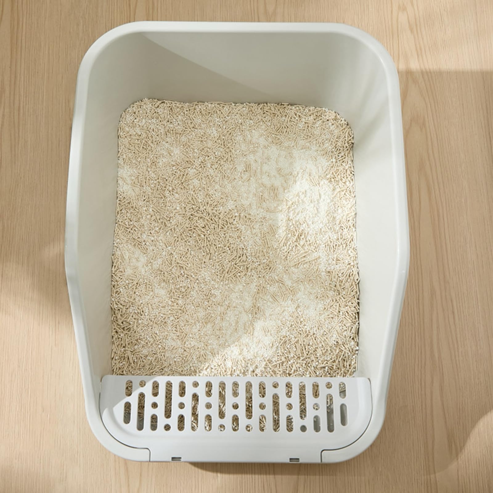SpaceTime kitty using litter box showing user-friendly setup