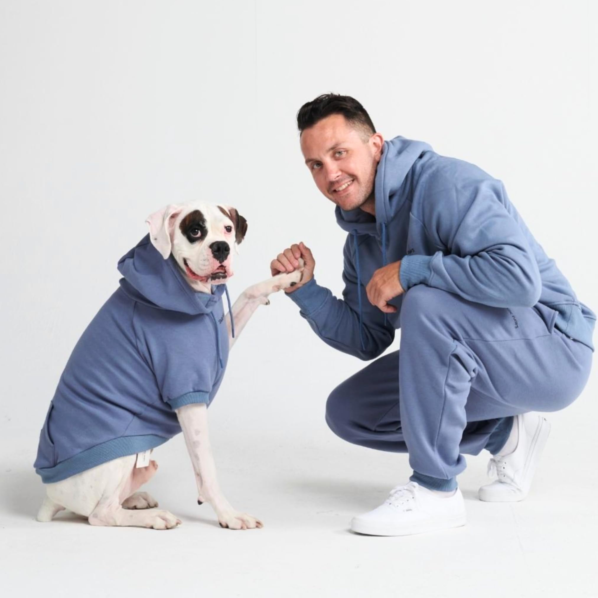 Spark Paws dog hoodie size M demonstrates warm, comfortable mid-size dog wear.