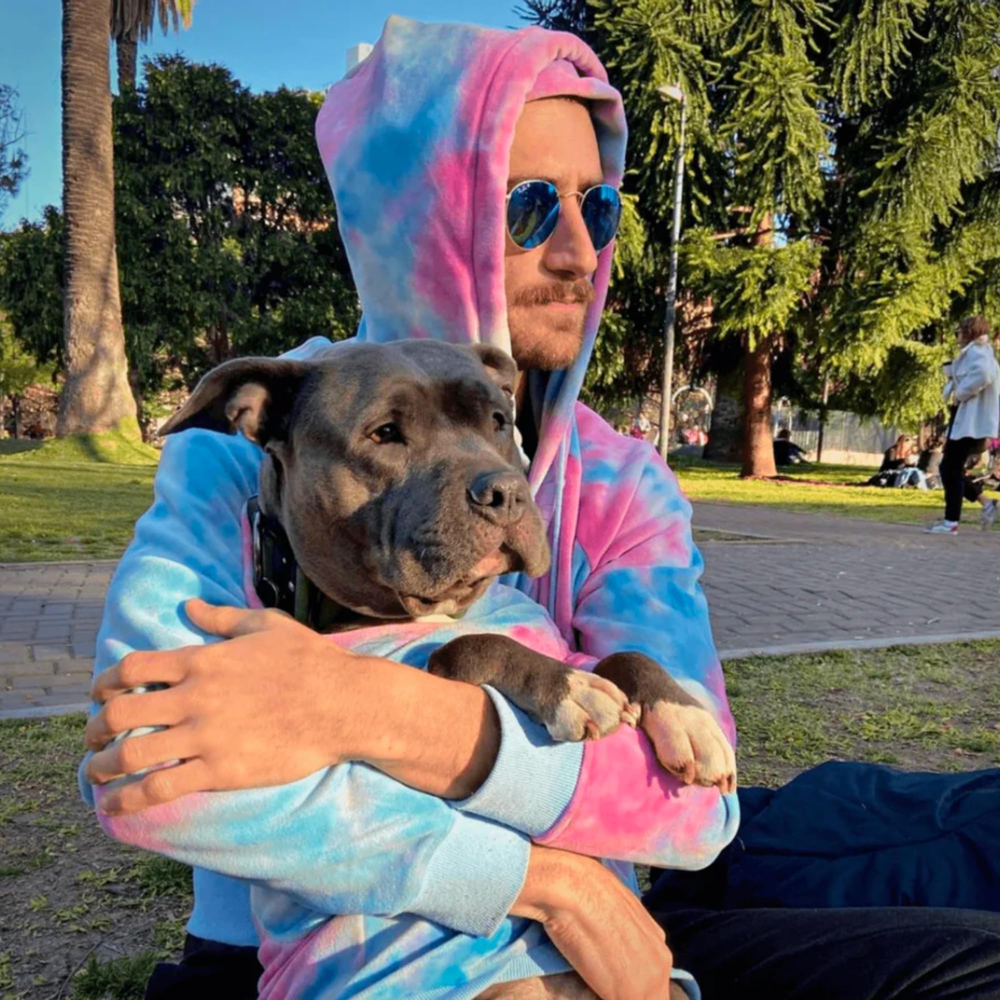 Spark Paws Human Hoodie drawcord hood emphasizes adjustable warmth during outdoor activities.
