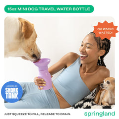 Springer by Springland dog water bottle lilac squeeze-action showing easy water release.