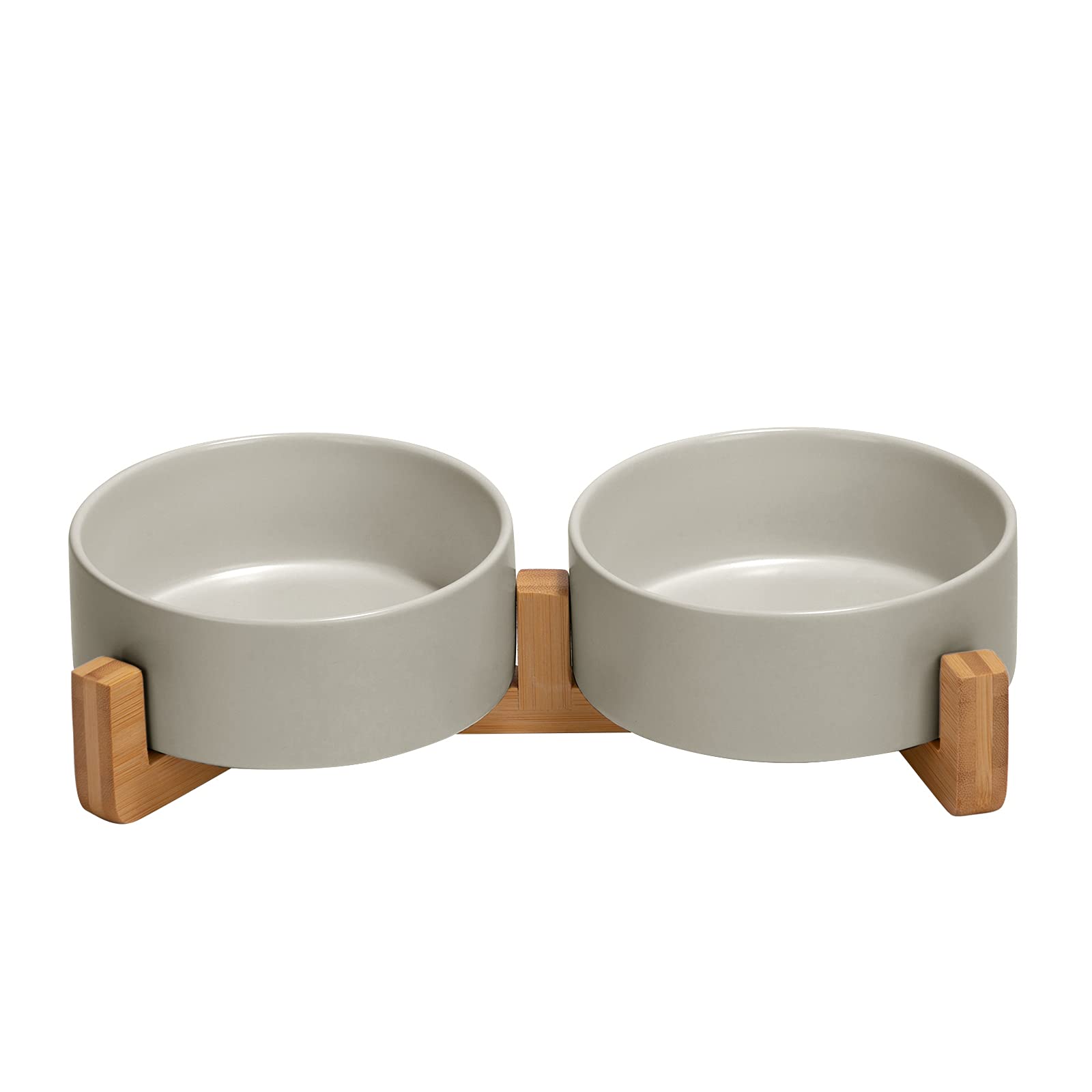 SPUNKYJUNKY ceramic dog bowl with wood stand reduces spills during meals.