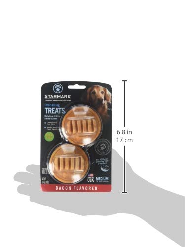 Dog chewing a medium Starmark Everlasting bacon-flavored chew.