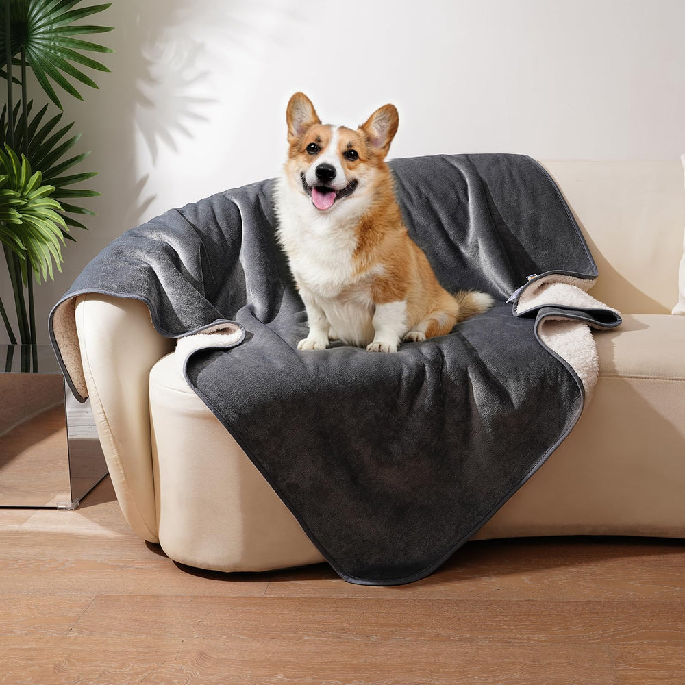 Sunheir waterproof dog blanket grey on couch showing plush Sherpa warmth for cozy lounging.