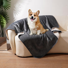 Sunheir waterproof dog blanket grey on couch showing plush Sherpa warmth for cozy lounging.