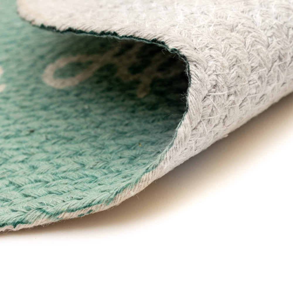 Super Area Rugs natural cotton feeding mat close-up highlights soft texture and handmade quality