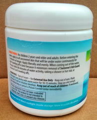 Family at the lakeside applies Swimmer Itch Guard for outdoor safety.