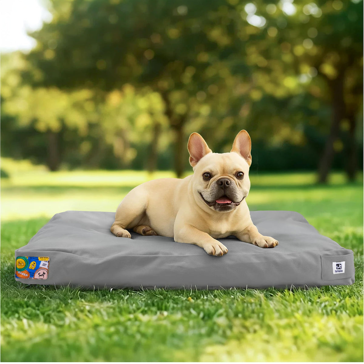 Sytopia outdoor canvas dog bed with waterproof cover for rain-ready outdoor lounging.