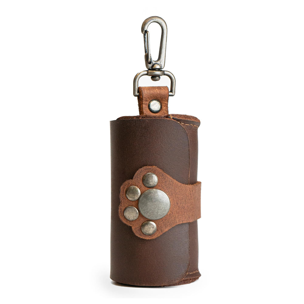Taco Dog paw poop pouch closure with paw print detail for easy cleanup on walks