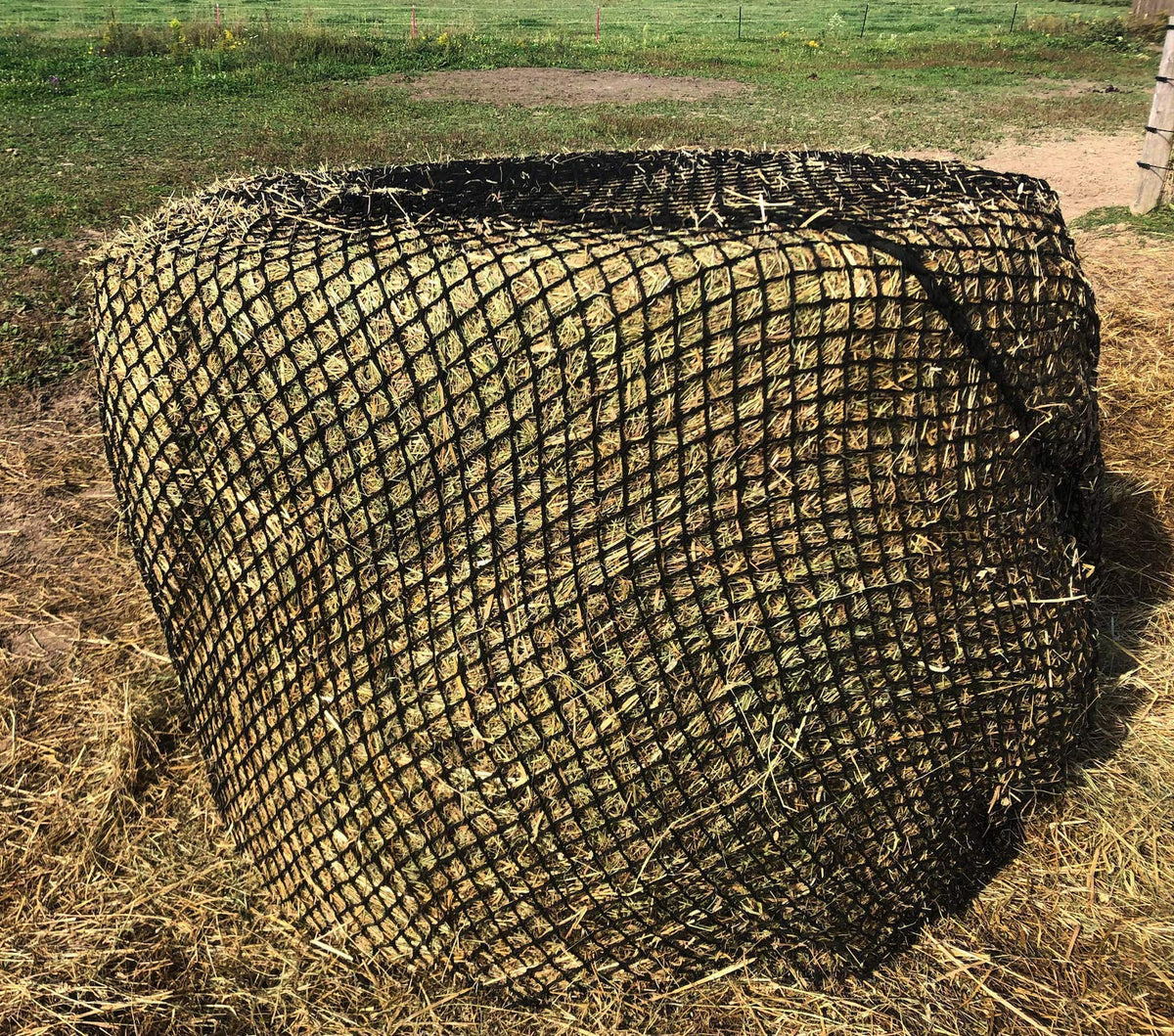 Tech Equestrian haynet over a 4x5 bale reduces waste and promotes steady feeding.