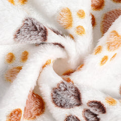 Tegeme paw-print blanket protects furniture from pet hair and dirt.