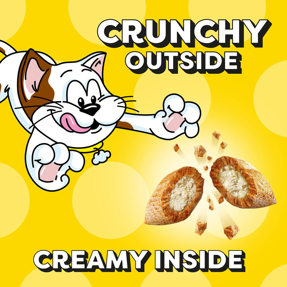 Temptations Classic Crunchy and Soft Cat Treats Seafood Medley cat sniffing the scent of treats.