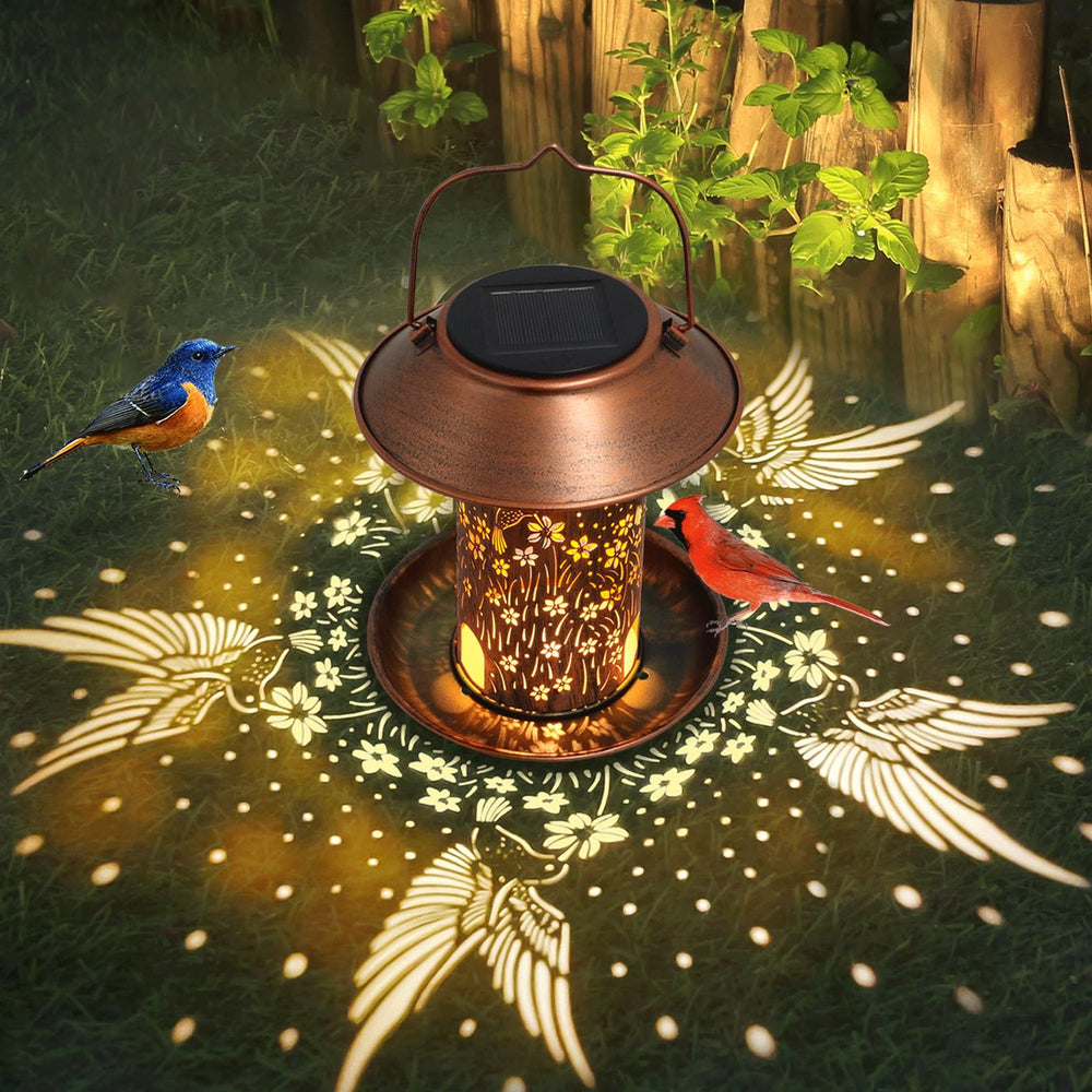 Tepaken solar bird feeder with water cups supports diverse seed-diet birds in outdoor spaces.