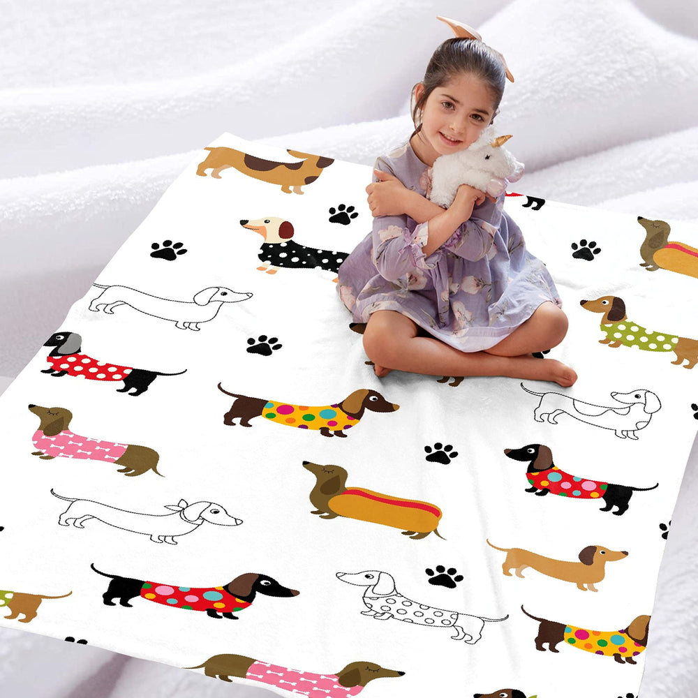 TERSTIN dachshund blanket on sofa adds plush warmth.