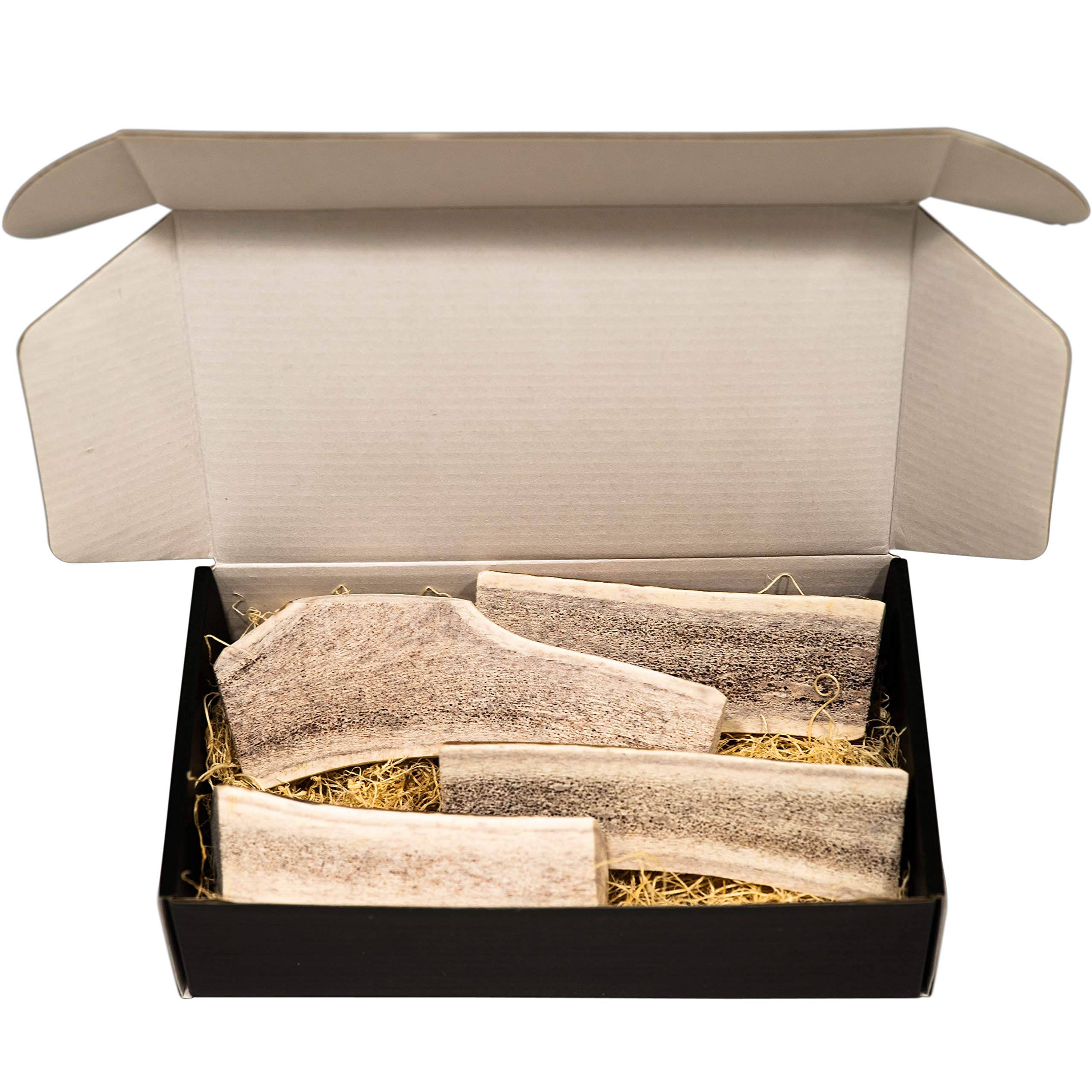 The Antler Box elk antler dog chews four pieces show long-lasting enrichment.