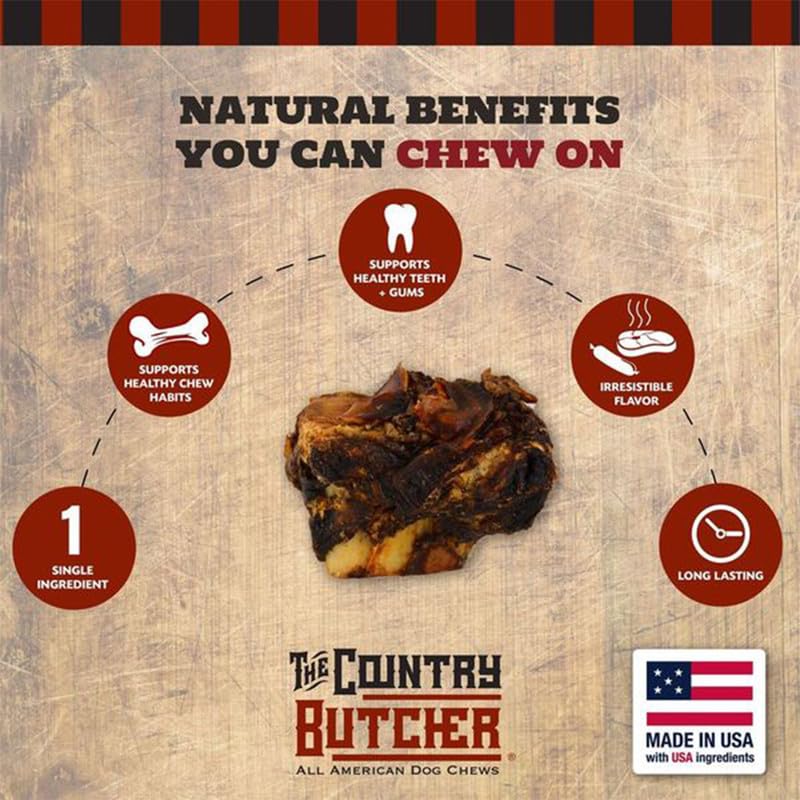 The Country Butcher beef knuckle bones in a dog's mouth during a satisfying chew.