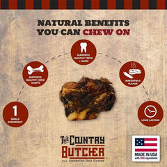 The Country Butcher beef knuckle bones in a dog's mouth during a satisfying chew.