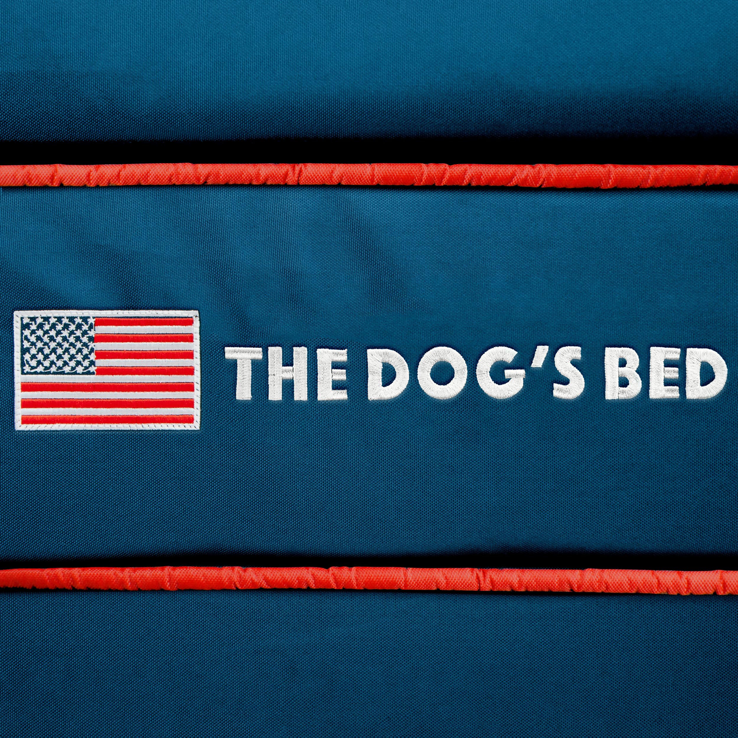 The Dog's Balls dog bed cover blue USA flag on-bed demonstrates integration with a space.