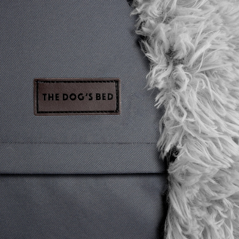 The Dog's Bed Sound Sleep nesting design hugs the body for calmer evenings.