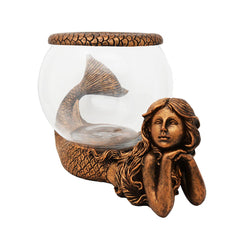 THE NIFTY NOOK Gold antiqued ring enhances the mermaid display as an accent.
