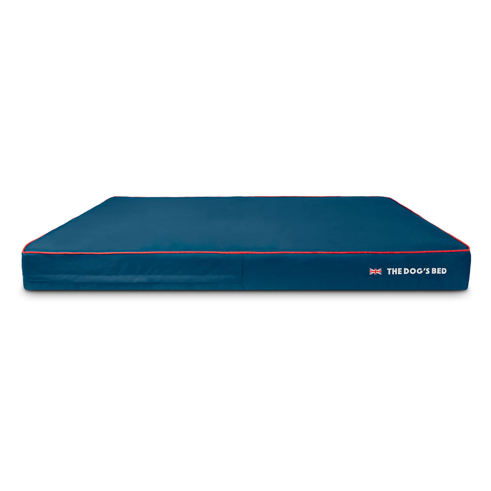The Dog's Beds blue outer cover with UK flag piping protects joints and keeps the bed tidy.