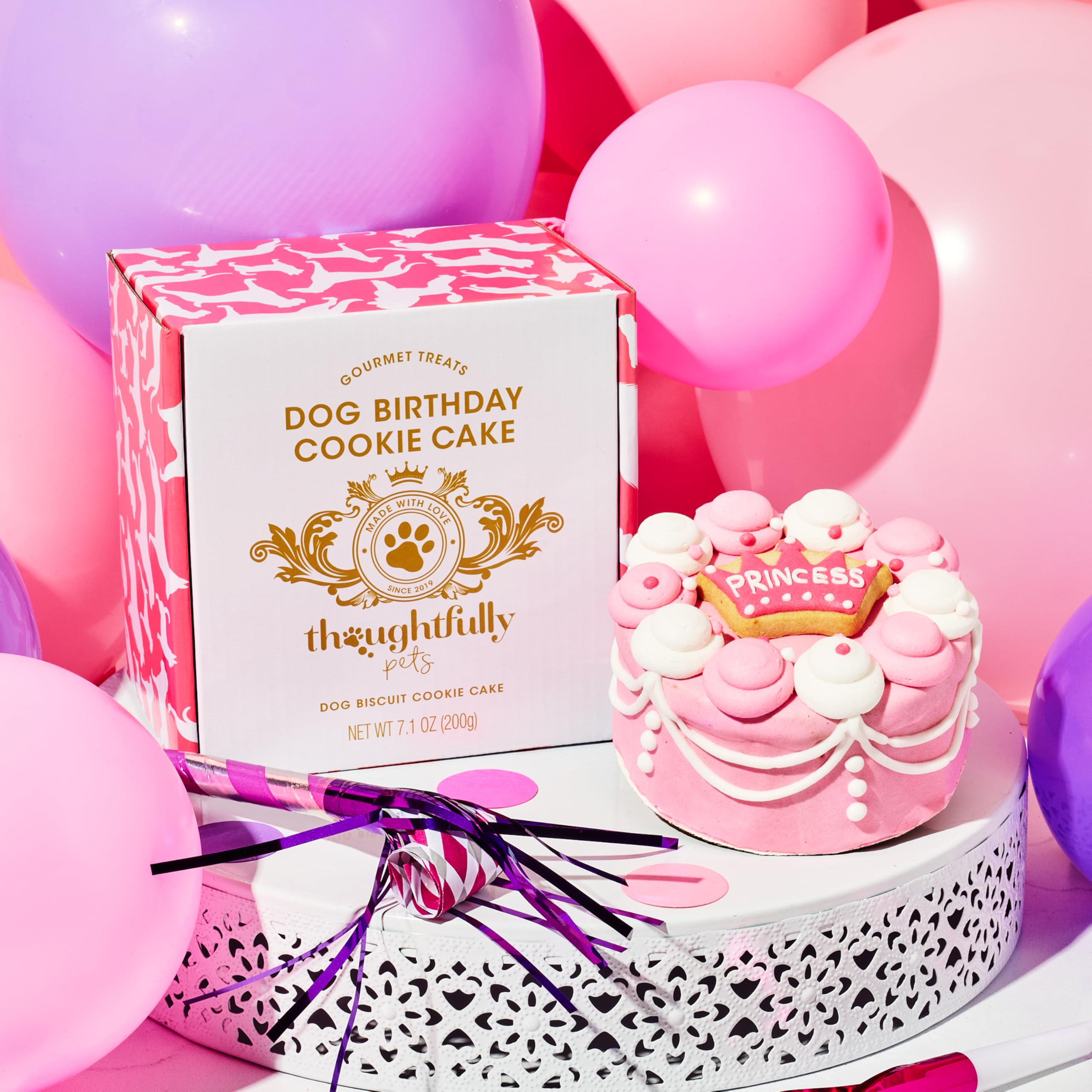 Thoughtfully Pets party setup with cake slices ready for dogs to enjoy