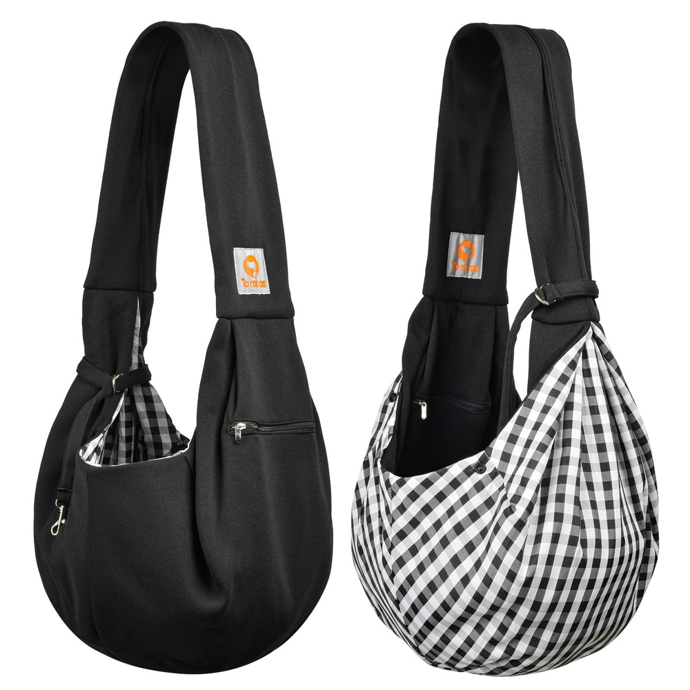 Tomkas black dog sling carrier blends with outfits for everyday use.