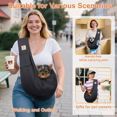 Tomkas dog sling carrier shows safety buckle for secure leash attachment.