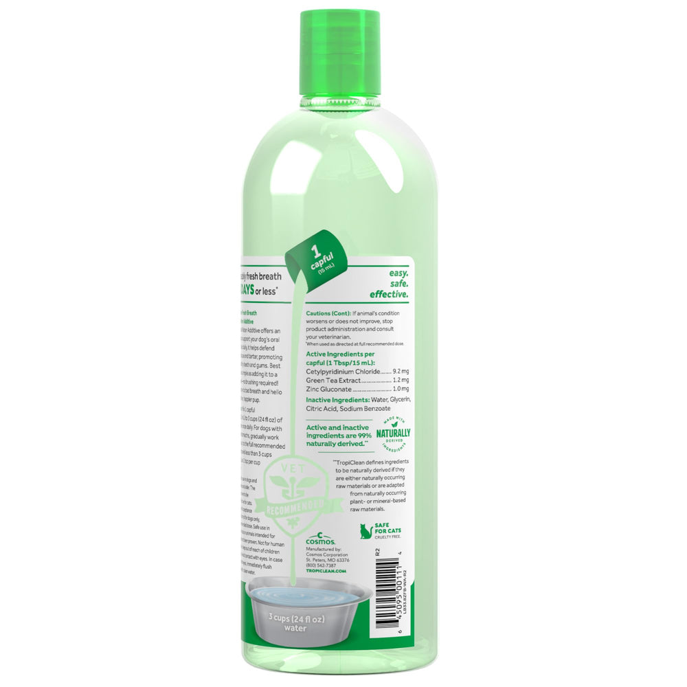 TropiClean Fresh Breath Water Additive being poured for simple daily dosing.