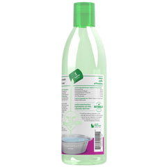 Pour TropiClean Water Additive into a dog's water bowl