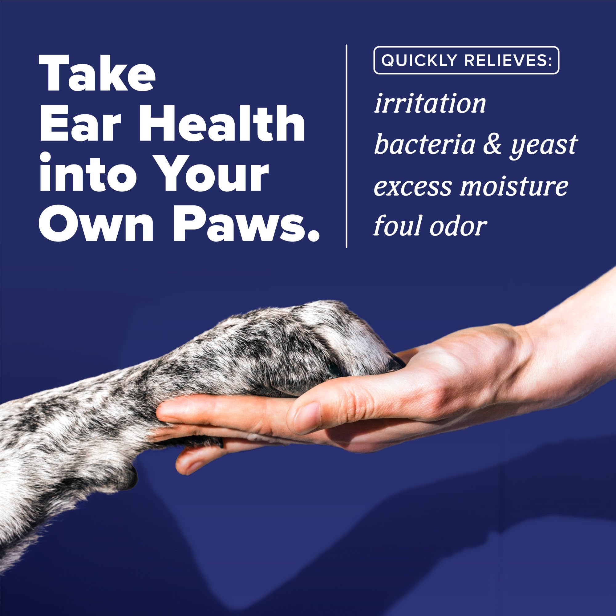 TropiClean HomeVet ear drops being applied to a dog's ear for relief