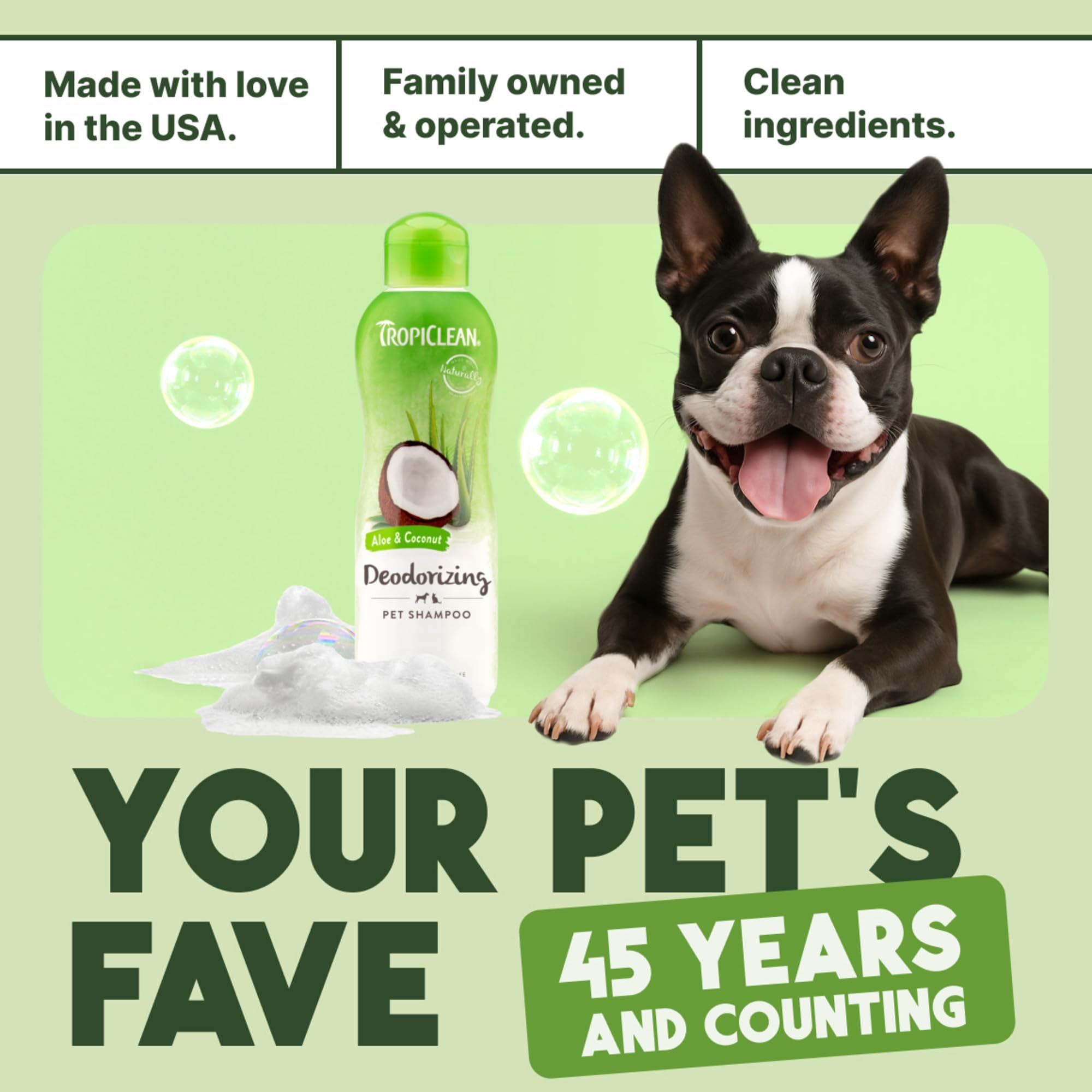 TropiClean professional dog shampoo used by groomers in a salon setting