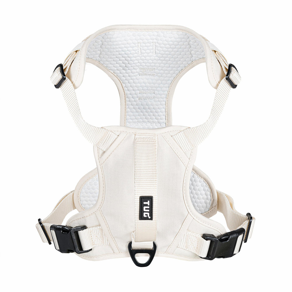 TUG dog harness with front clip in cream redirects pulling during busy walks