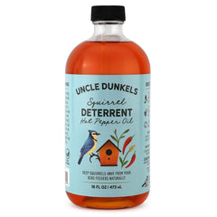 Uncle Dunkels spicy pepper deterrent bottle close-up showing natural seed protection for birds.