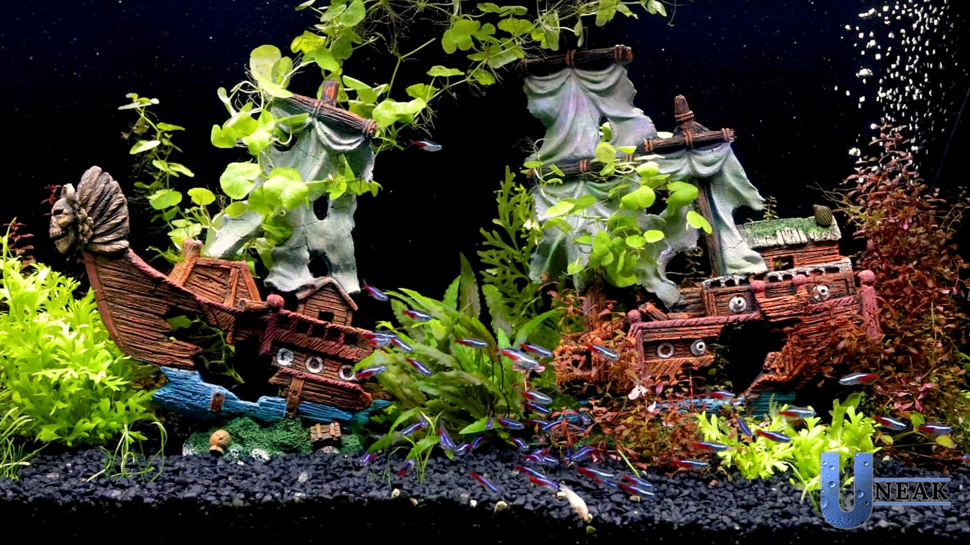 UNEAK shipwreck aquarium ornament side view highlights resin texture and painted details.