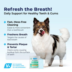 Dog with chicken-flavored Dentabliss wipes during brushing.
