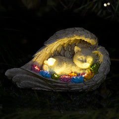 VKEVOC cat memorial stone with solar-winged angel lights the garden at night