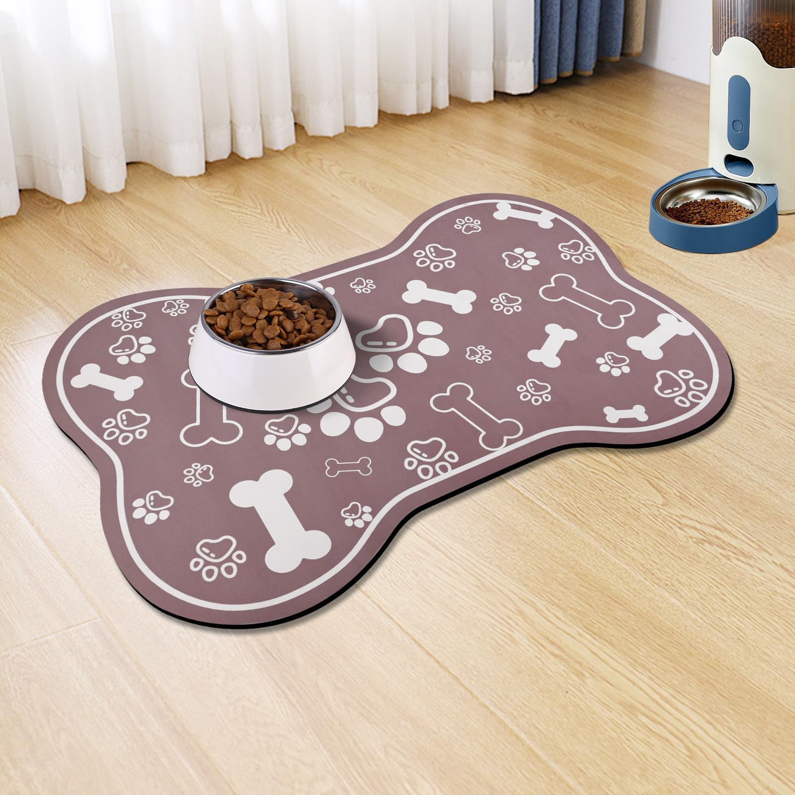 Voanos bone-shaped mat with non-slip backing keeps bowls steady during meals.