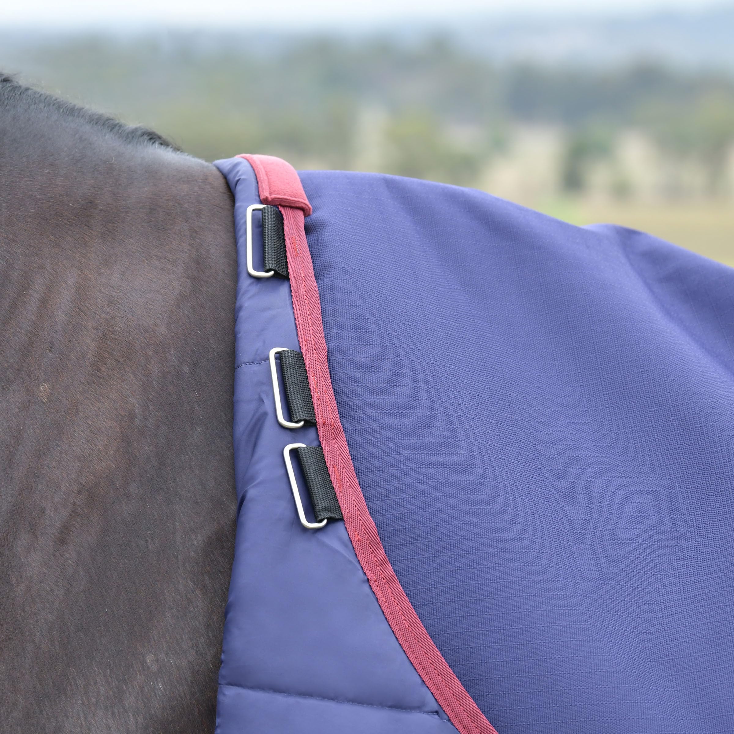 WeatherBeeta ComFiTec Essential Turnout tail flap and reflective trim enhance visibility.