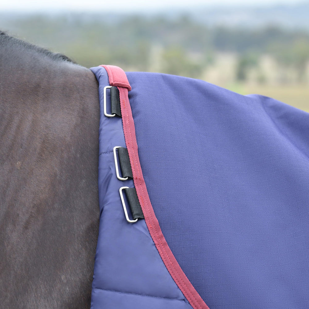 WeatherBeeta ComFiTec Essential Turnout tail flap and reflective trim enhance visibility.