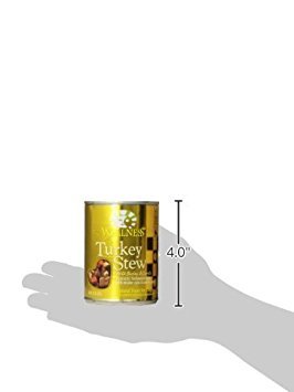 Wellness variety-pack dog meal setup showing three flavors for picky eaters.