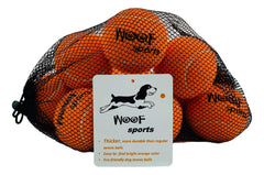 Woof Sports dog tennis balls orange pack, high-visibility fetch for grassy yards.