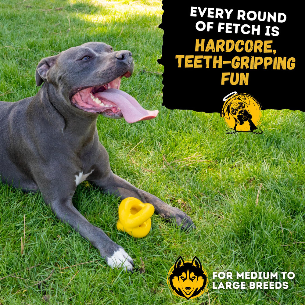 WoofBite Indestructible Ball undergoing durability test on tough chewer