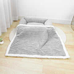 WowOhPet waterproof pet blanket on couch with sherpa for cozy lounging