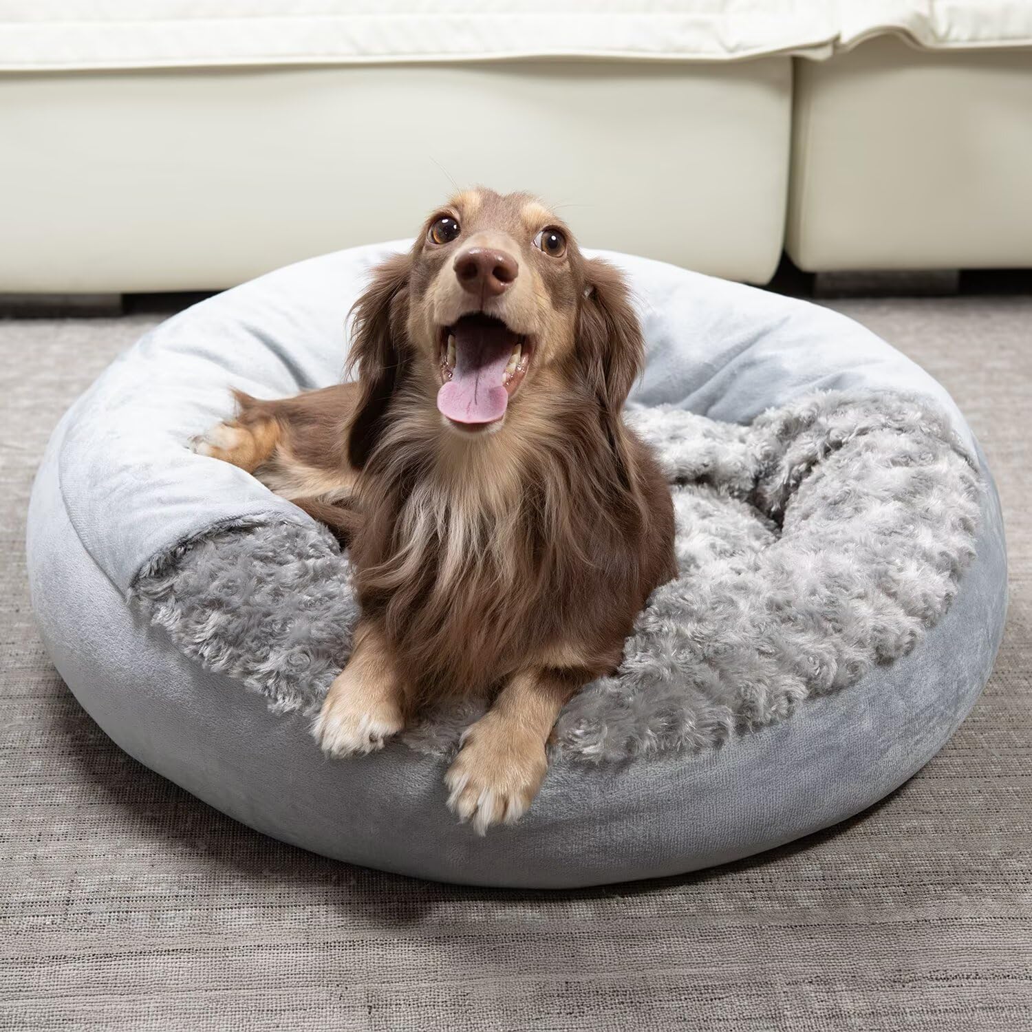 Xavaro cave dog bed with soft rosy fur cover promotes cozy snuggling and warmth.