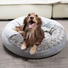 Xavaro cave dog bed with soft rosy fur cover promotes cozy snuggling and warmth.